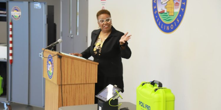 COOK COUNTY CLERK Karen Yarbrough presents new electronic voter check-in equipment during a recent press conference. (Photos courtesy Cook County Clerk’s Office)