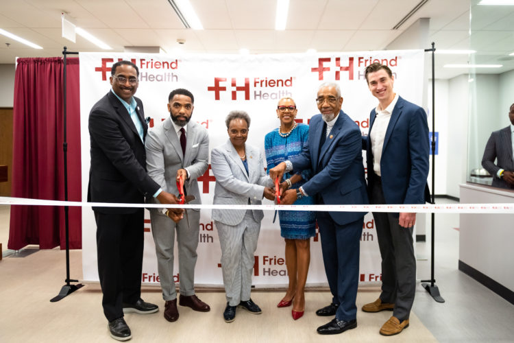 FRIEND FAMILY HEALTH Center held its grand opening of the Woodlawn Health Center on July 8, 2022. Pictured cutting the ribbon, l-r: Leon Walker, Managing Partner, DL3; Sean Harden, Chairman, Friend Health; Mayor Lori E. Lightfoot, City of Chicago; Verneda Bachus, CEO, Friend Health; and Congressman Bobby Rush (IL-01). (Photos by Nicee Martin Photography)