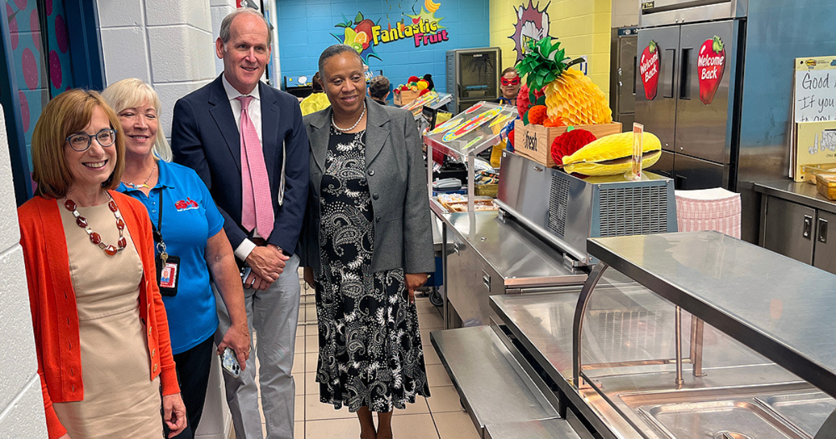IN THE CAFETERIA serving line at O’Bannon Elementary School is Cindy Long, USDA Food & Nutrition Service Administrator, (l-r), Lynn Strle, Assistant Director School City of Hammond FNS, Alan Shannon, USDA FNS Public Affairs Director, and Vista Fletcher, USDA Midwest Regional Office Administrator