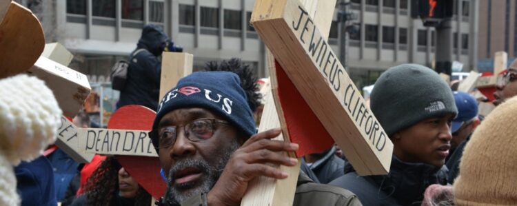2 Bearing the cross a man is among hundreds who carried crosses down Michigan Avenue last New Years Eve website 2