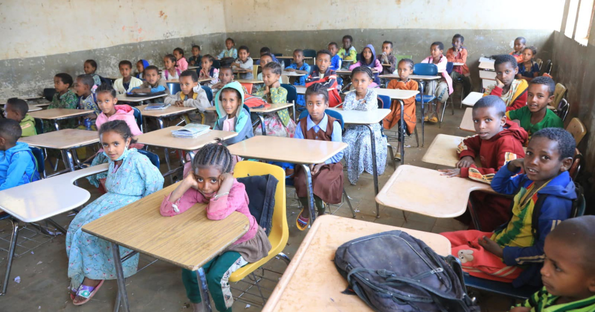 STUDENTS FROM KECHIN MESK Elementary and Junior High School and Nefas Mewucha, Junior High School, in Debre Tabore, Ethiopia are seated at the desks donated by the Gary Community School Corporation. A war that took place in 2021 and 2022 destroyed their desks and caused approximately one-fourth of the students to complete their classwork while seated on uncomfortable wooden benches made from tree trunk.