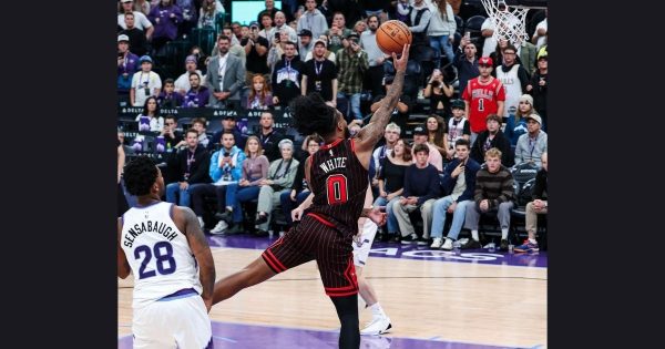 Bulls Guard Coby White (#0) shoots a layup following  his return from injury in the 150-147 double overtime loss against the Utah Jazz.
