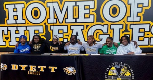 Senior student-athletes sign commitment papers to various colleges and universities throughout the country during the schools' Signing Day ceremony. (Photo Stephanie Gadlin)