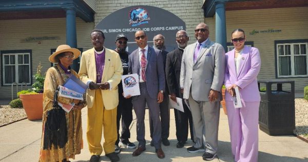 AMONG THE ATTENDEES were left to right: Gail Kayiwa, her husband, Bishop Leonard Kayiwa, Allen Sanders, Attorney Enoch J. Edmond, Gospelizer Rev. Dr. Walter McCray, Presiding Elder James Moody, Rev. Paul Jakes, and Chaundra Van Dyk-McGee. (Photo by Chinta Strausberg)