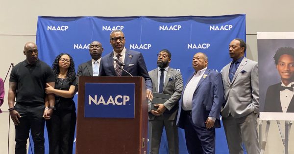 NAACP President Derrick Johnson opens a press conference at the NAACP National Convention in Chicago before civil rights attorney Ben Crump presented findings from an independent autopsy in the death of 18-year-old Nolan Wells. 