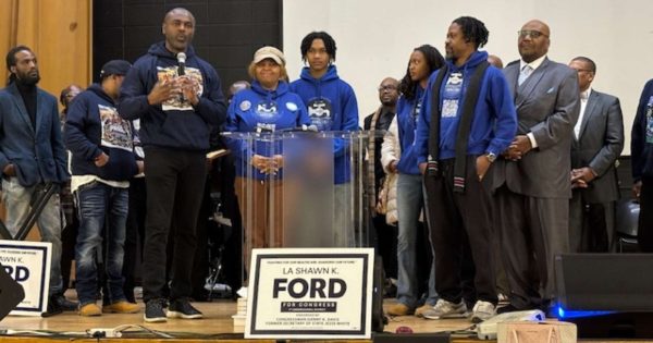 La Shawn Ford introduces the Mitchell family during press conference at the Englewood Center. The parents and their children actively support programs to improve the community.