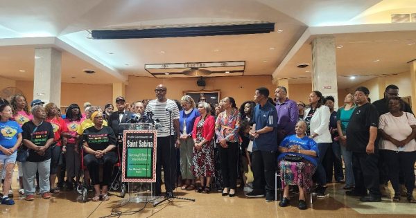 St. Sabina Church leaders and supporters call for Father Michael L. Pfleger's return and reforms to the Archdiocese's investigative policies during a news conference. (Photo by Chinta Strausberg)